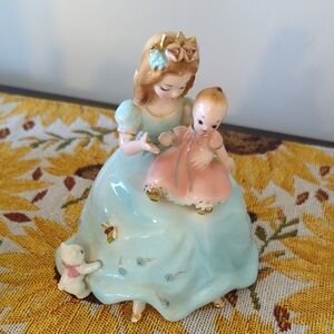 Joseph's Ceramic Figurine with Blue and Pink Dress